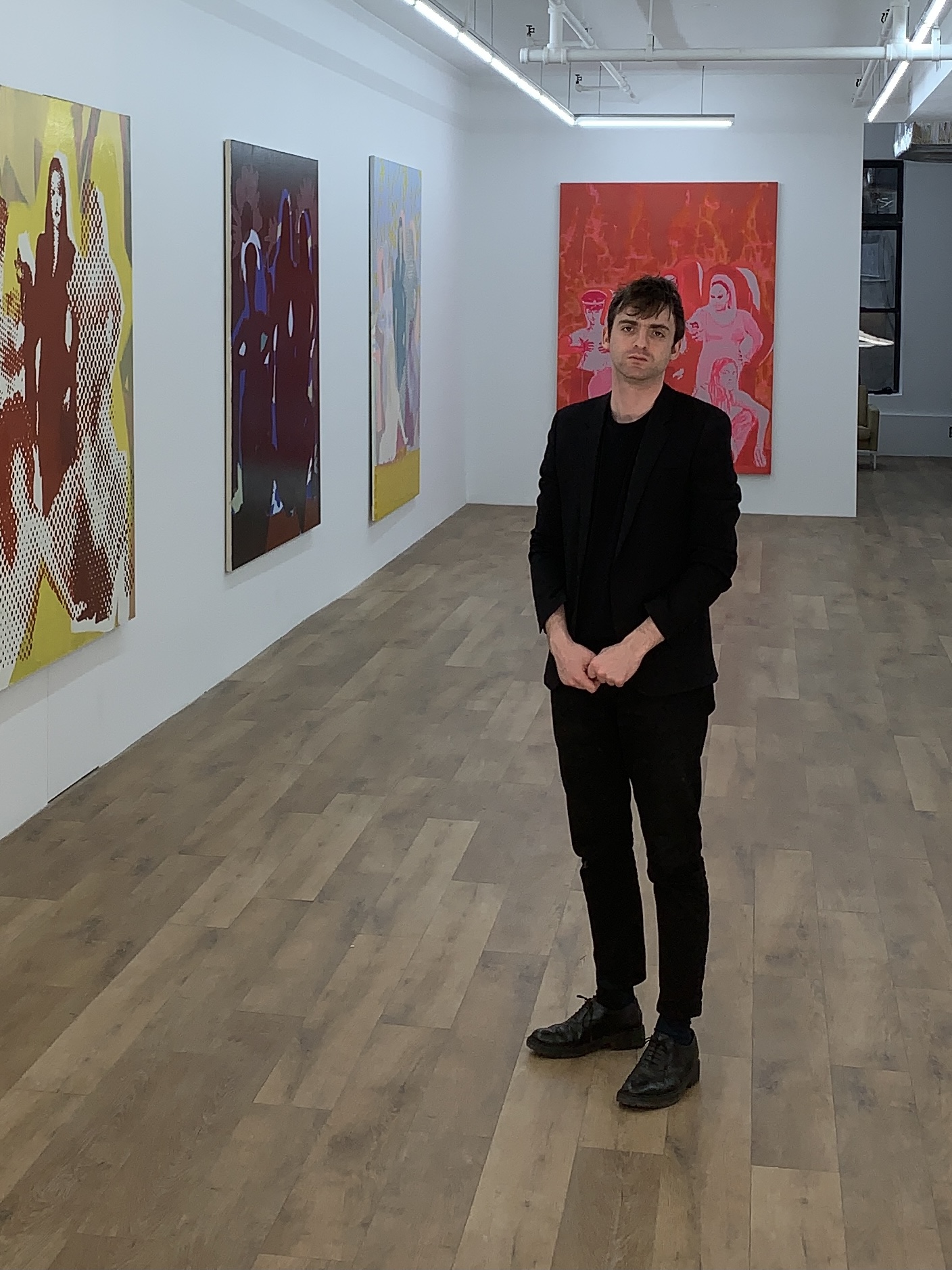 Alexander Shulan standing inside Lomex Gallery